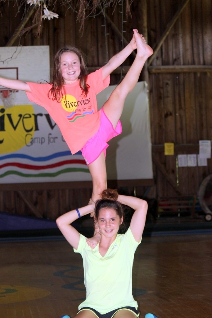A cheerleading stunt at camp