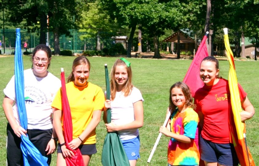 Flag twirlers performing at camp