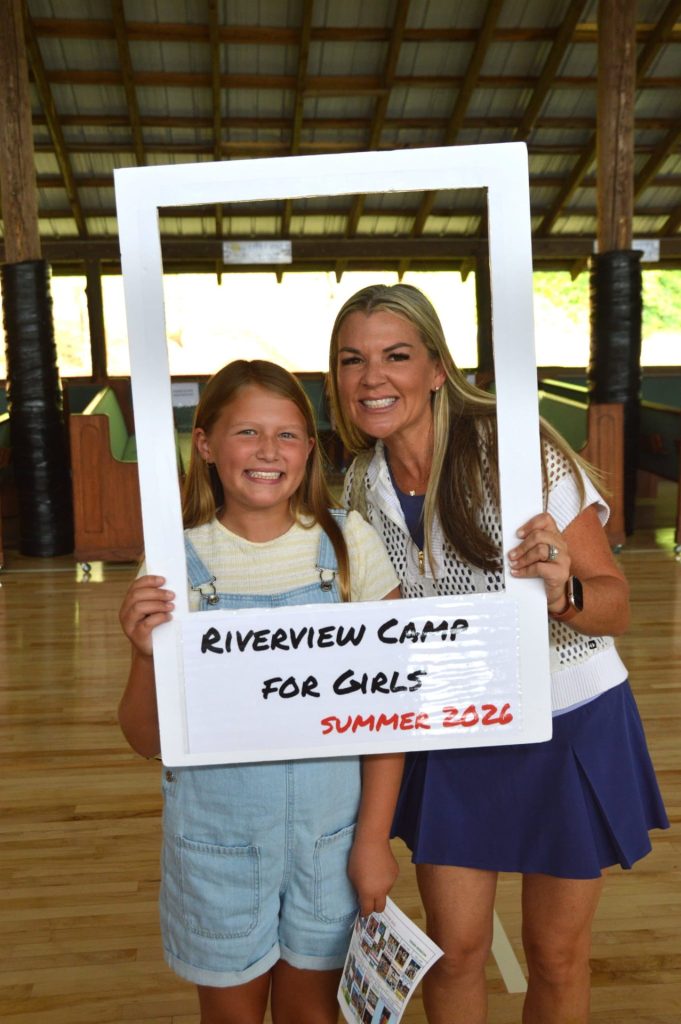 A mother and daughter posing together at Riverview