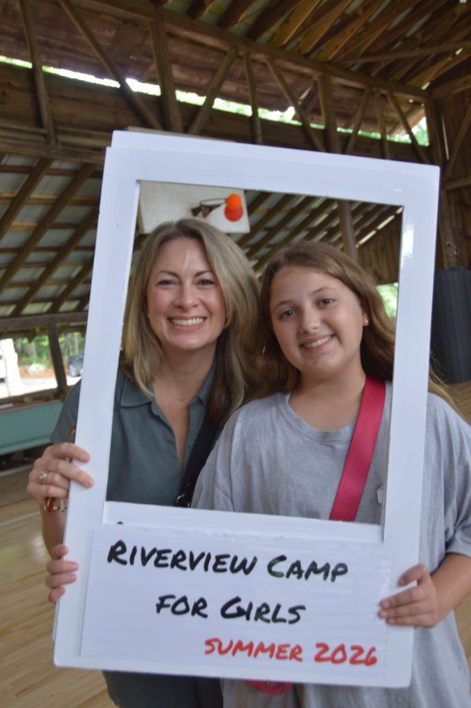 A mother and daughter smiling together in a Riverview photo frame